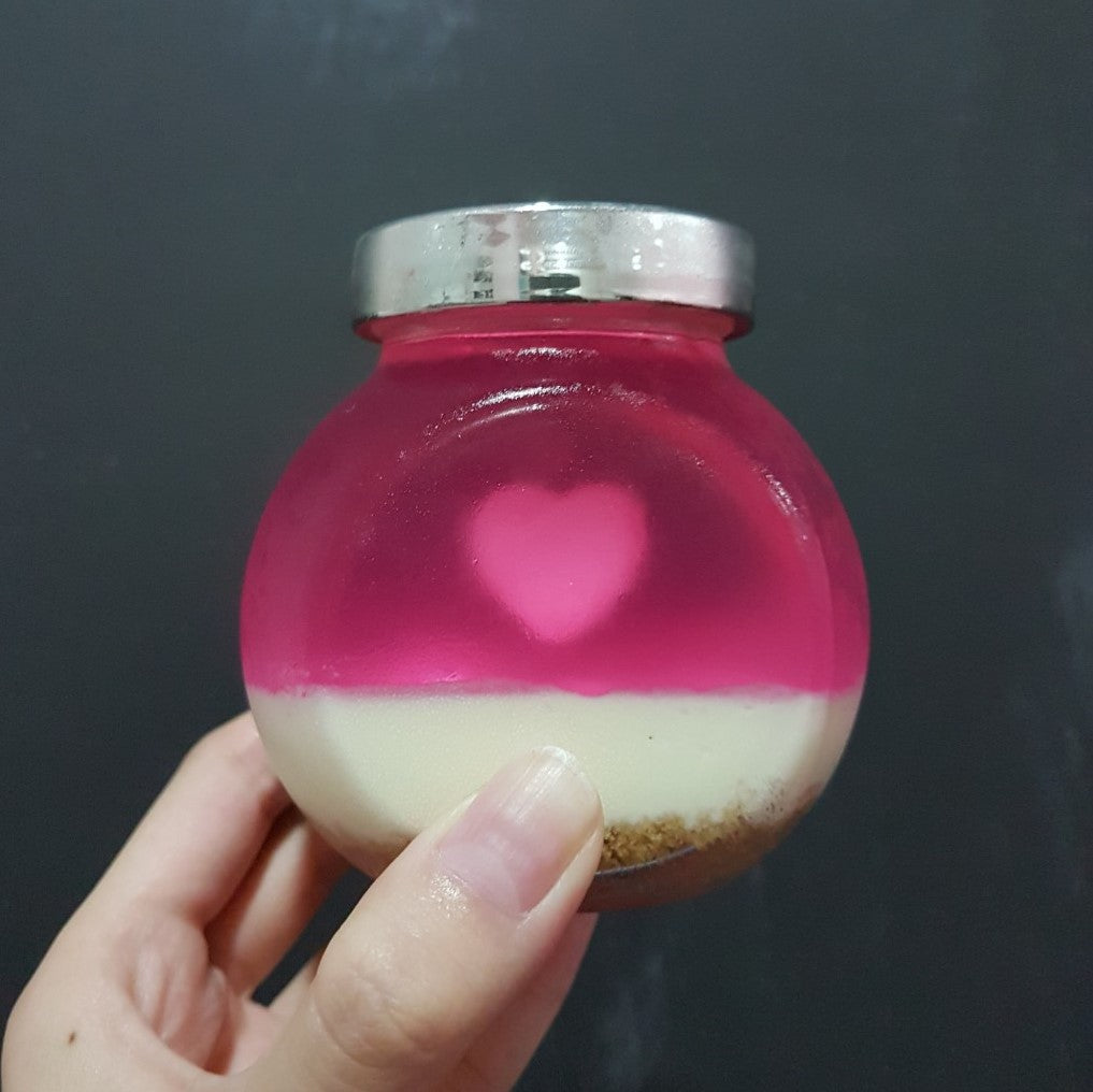 Jelly cheesecake in a Jar with a heart shape